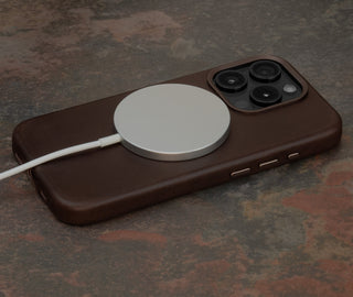 MagSafe charger attached to the Dark Brown Slimline Leather Bumper Case for iPhone 15 Pro
