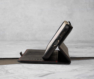 The stand function of the Black Leather with Red Stitching TORRO Folio Case for Samsung Galaxy S21 FE 5G