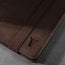 Close up of the leather grain and TORRO bulls head logo on the Dark Brown Leather Case for iPad Air