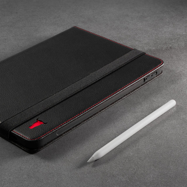 Highlighting the groove in the inner frame of the Black Leather (with Red Stitching) Case for iPad Pro 11-inch allowing it to magnetically attach and charge