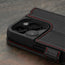 Camera cutout on the Black with Red Detail Leather Wallet Case for iPhone 15 Pro Max