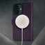 MagSafe charger attached to the Purple Leather Case for iPhone 16