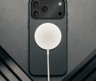 MagSafe charger attached to the Slimline Black Leather Bumper Case for iPhone 17 Pro Max