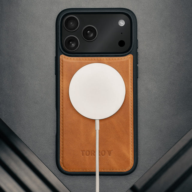 MagSafe charger attached to the Dark Brown Leather Detachable Case for iPhone 17 Pro Max