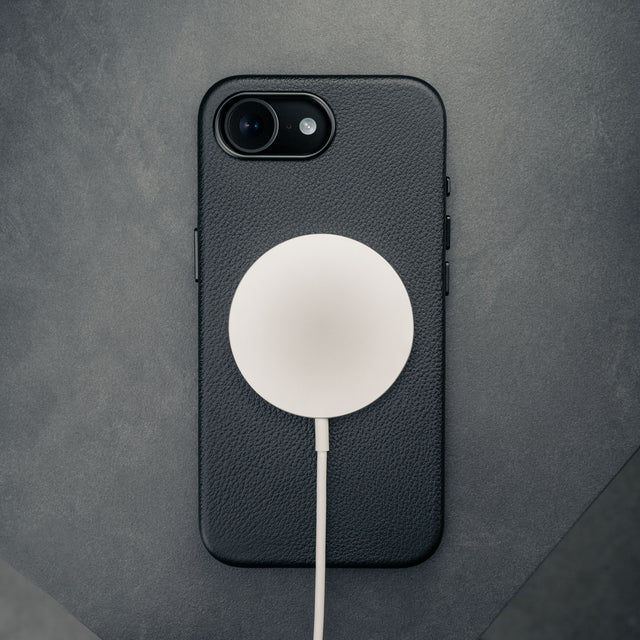 MagSafe charger attached to the Black Slimline Leather Bumper Case for iPhone SE4 (2025)