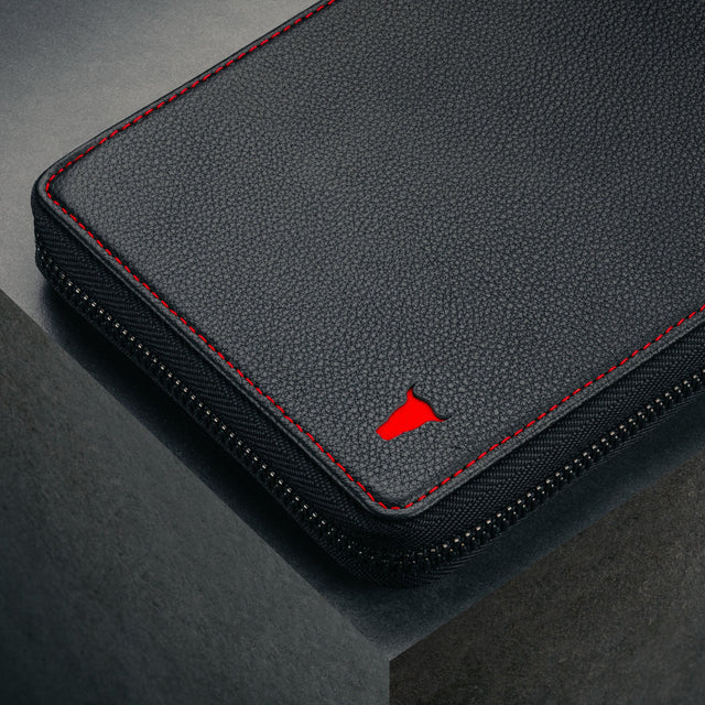 Close up of the heavy duty, long lasting zip on the Black Leather with Red Stitching Solo Travel Wallet
