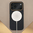 Wireless charger attached to the Black with Gold Detail Woven Texture Bumper Case for iPhone 17 Pro